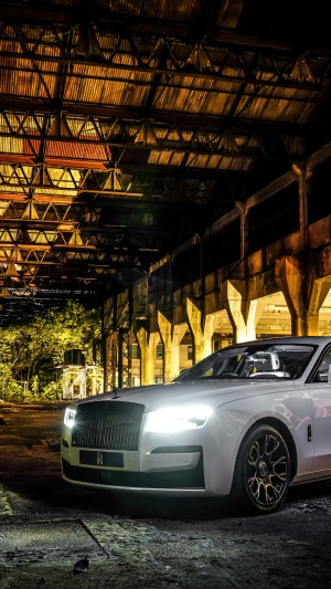 White Rolls-Royce Ghost in abandoned industrial building
