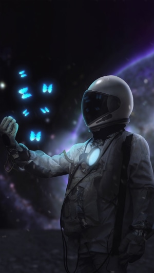 Astronaut with glowing blue butterflies in space