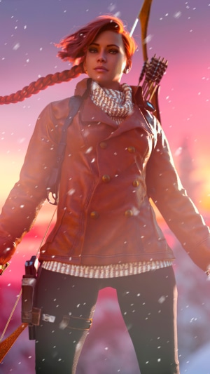 Woman with bow and arrow in winter