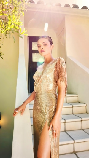 Lucy Hale in a gold sequined dress