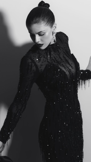 Alexandra Daddario in a black sequined dress, monochrome photoshoot