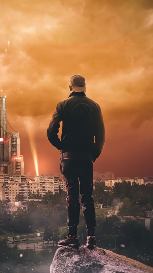 Man in a cap looking at a futuristic city