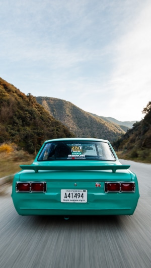 Rear view of a teal Nissan Skyline GT-R