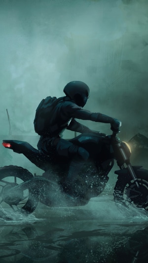 Biker riding a motorcycle through water