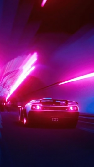 Lamborghini driving through a neon tunnel