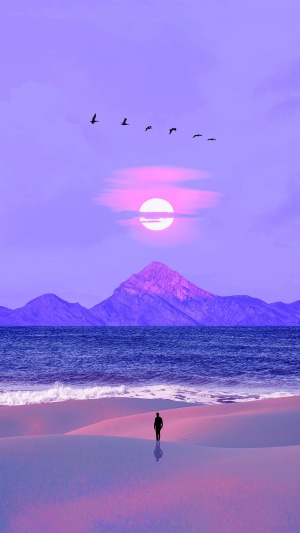 Person walking on beach with mountains and sun