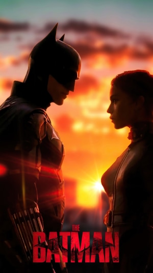 The Batman and Catwoman in front of sunset
