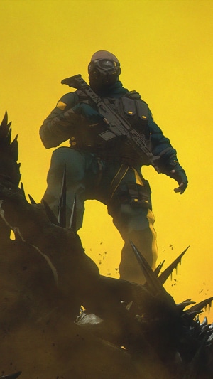 Soldier with rifle in a yellow environment