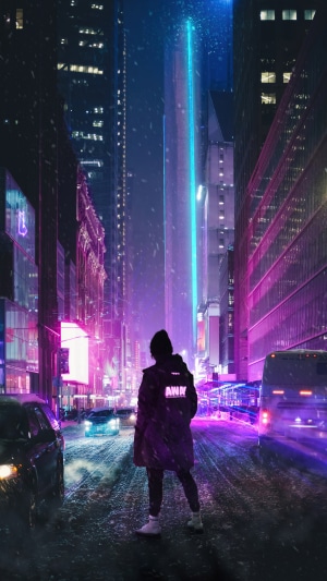 Person in a neon city at night
