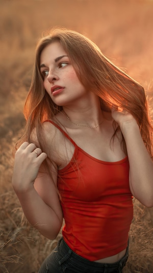 Girl with long hair in a red top