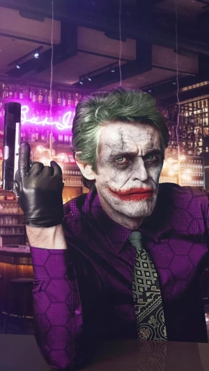 Joker with a gun in a bar