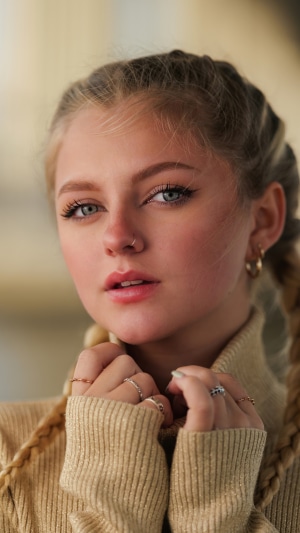 Young woman with braided hair wearing a turtleneck