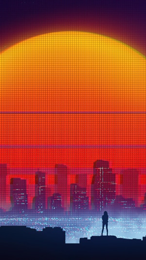Silhouette of a person overlooking a city at sunset