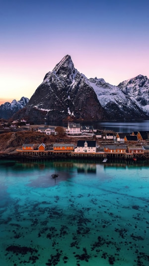 Mountain village by the sea at sunset 4K