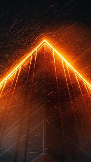 Building with orange neon lights in snow