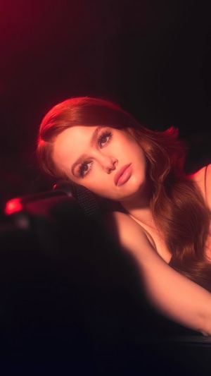 Madelaine Petsch in a red-lit photoshoot