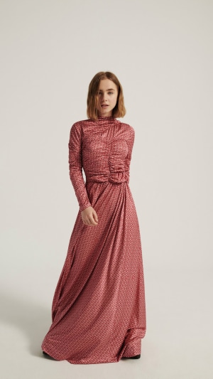 Clara Galle in a red patterned dress