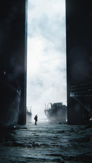 Man standing between derelict ships under cloudy sky