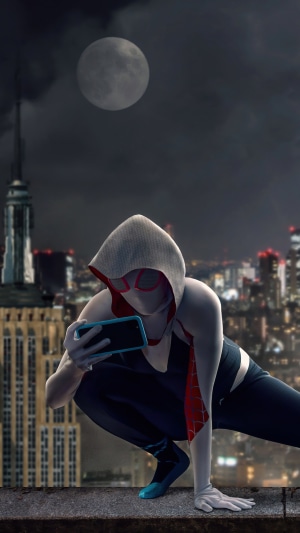 Gwen Stacy from Spider-Man taking a selfie on a rooftop
