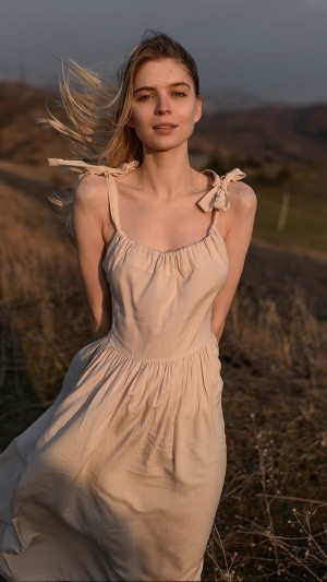 Young woman in a dress in a field