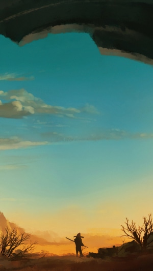 Silhouette of a person with a staff in a desert landscape