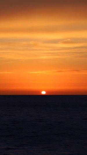 Sunset over the sea at dusk