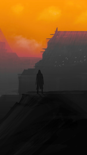Figure standing on a cliff at sunset