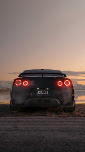 Black Nissan GT-R with custom license plate
