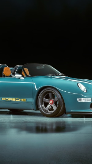 Teal Porsche 911 convertible with yellow PORSCHE text