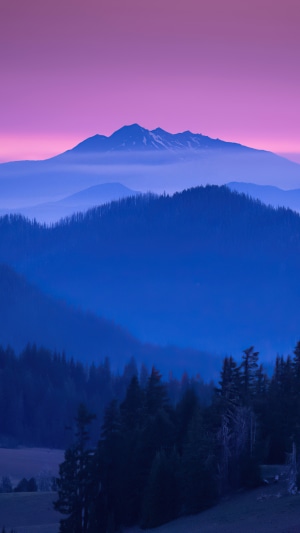 Mountains at sunrise with purple sky