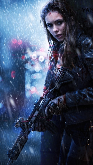 Woman with assault rifle in the rain