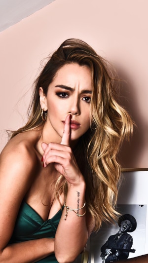 Chloe Bennet posing with finger on lips