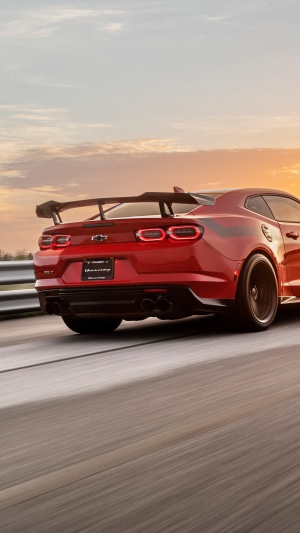 Red Chevrolet Camaro with Spoiler on Track