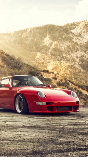 Red Porsche 911 400R on a mountain road