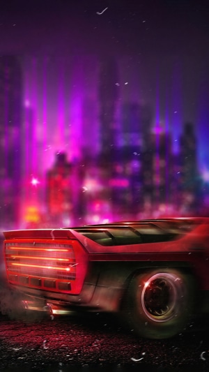 Red car in a neon city at night