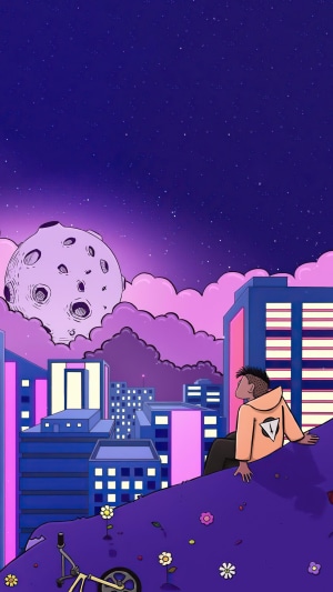 Man sitting on hill overlooking city with moon in sky
