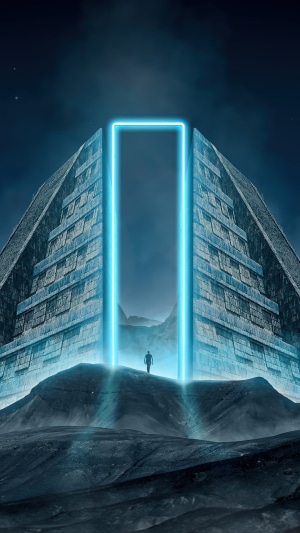 Man standing before a glowing portal on a pyramid