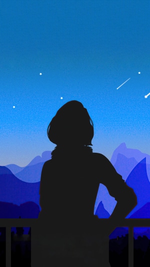 Silhouette of a person watching shooting stars over mountains