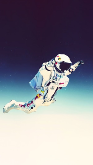 Astronaut in a Red Bull suit in space