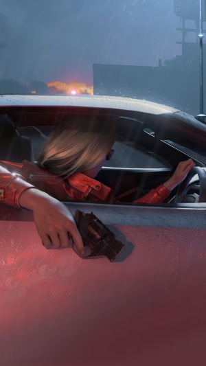 Woman in red jacket holding a gun in a car
