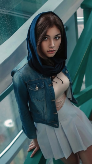 Model wearing a denim jacket and scarf