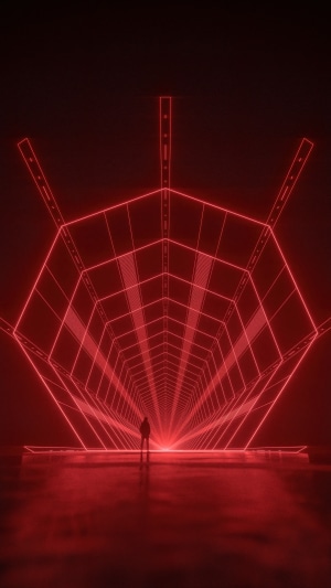 Man standing in a red neon geometric tunnel