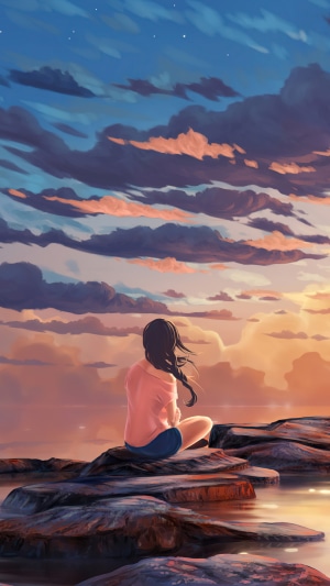 Girl sitting on rocks at sunset