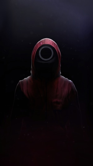 Squid Game guard in red hoodie with circle mask