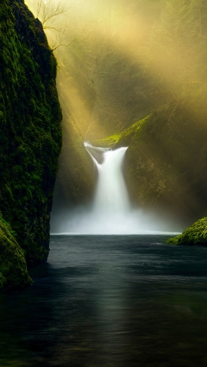 Waterfall with Sunbeams in a Mossy Canyon 4K