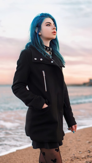 Woman with blue hair on a beach