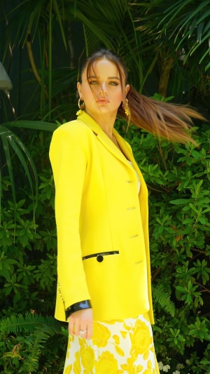 Joey King in Yellow Blazer and Floral Skirt
