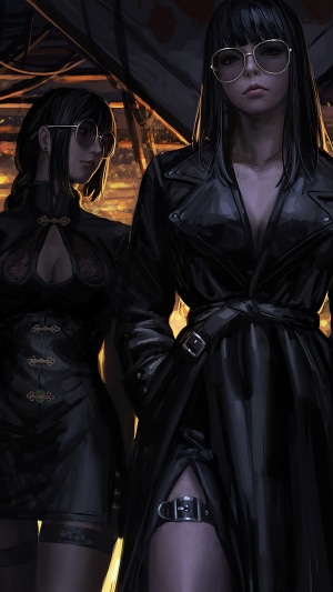 Two women in black outfits and sunglasses