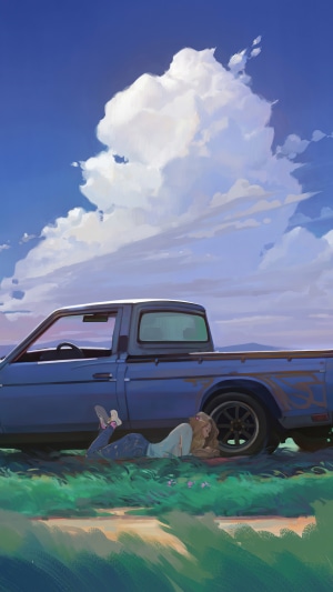 Girl lying by a blue pickup truck under clouds