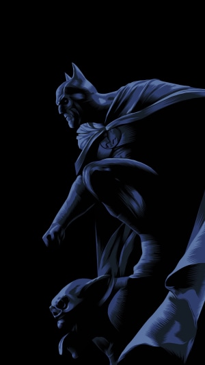 Batman perched on a gargoyle